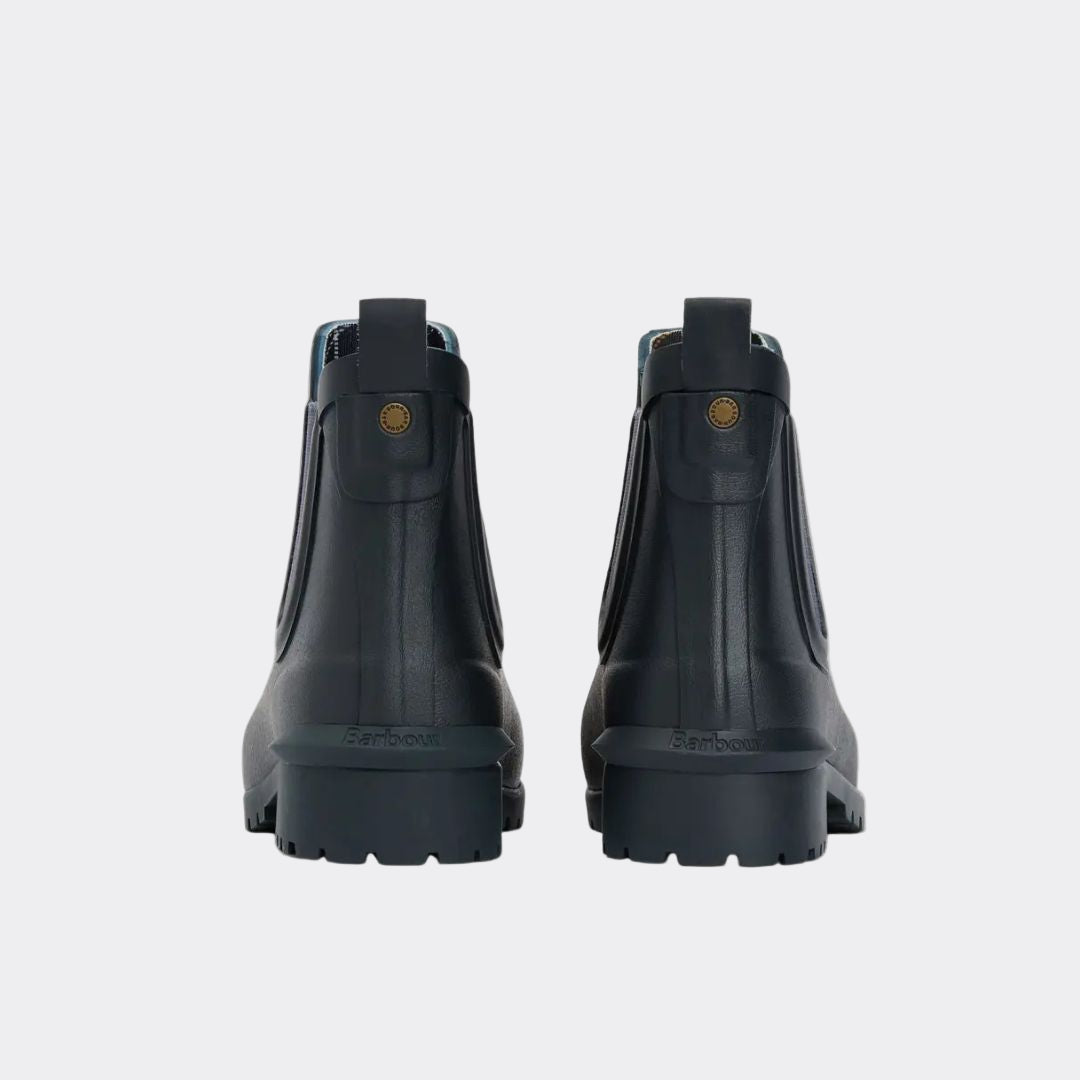 Pair of black rubber boots on a white background
