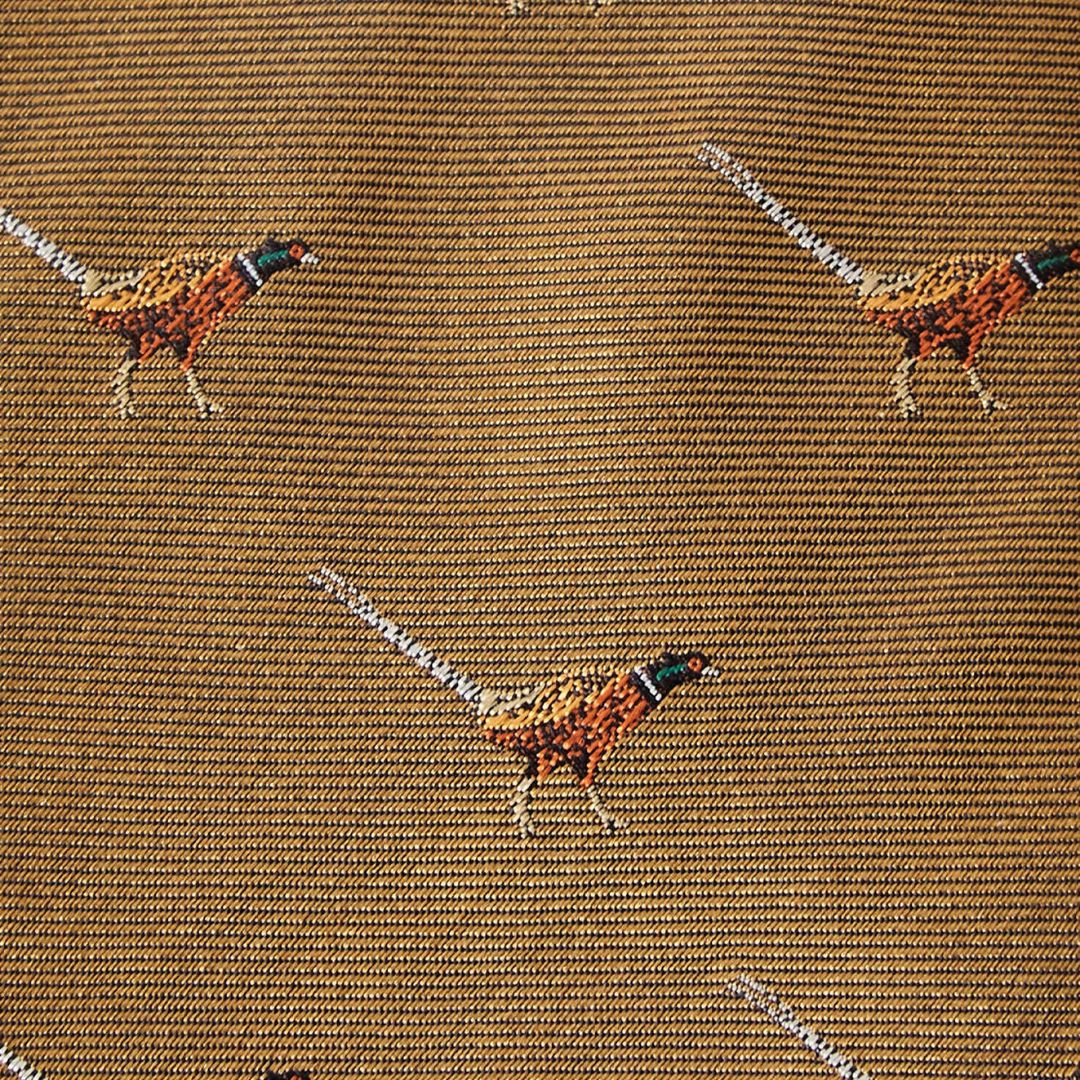 Pattern of pheasants on a textured brown fabric background