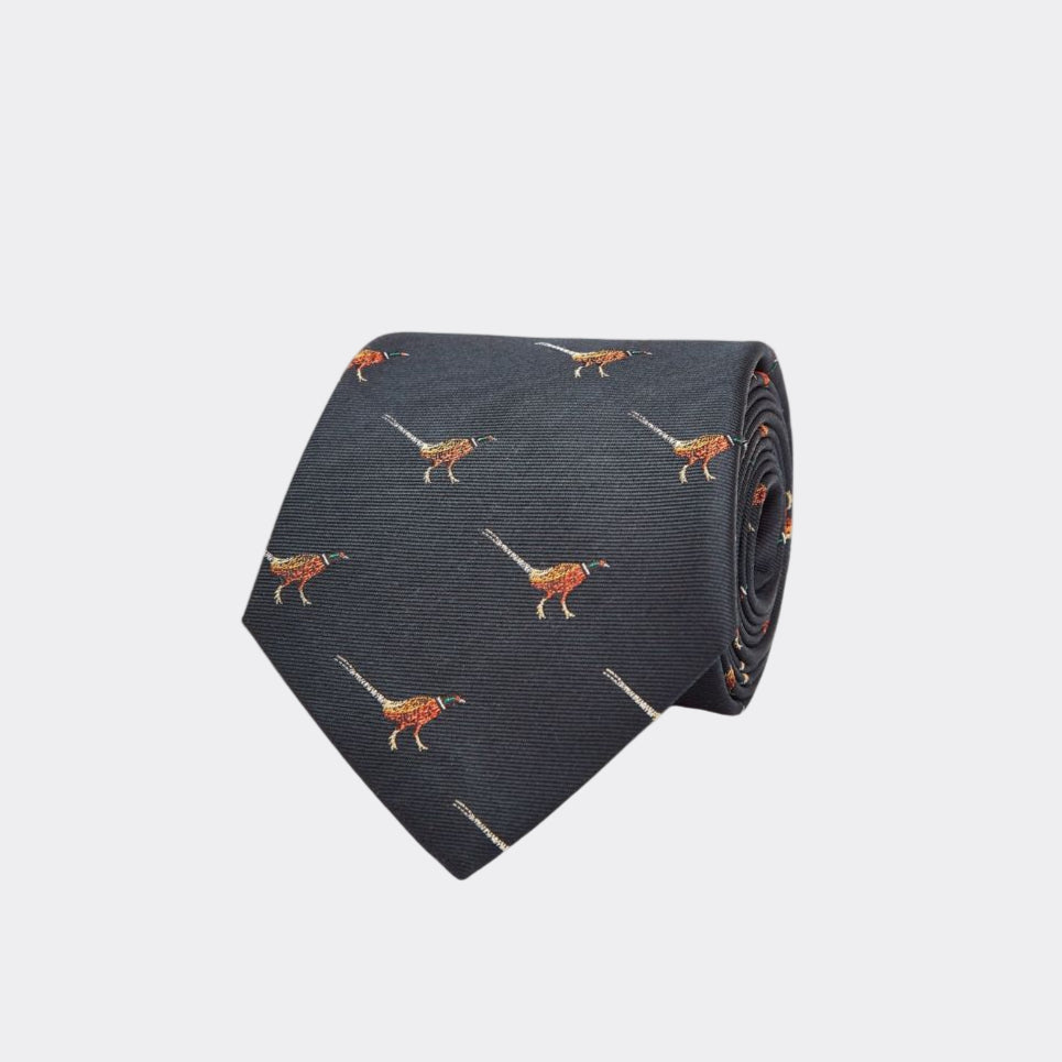 Navy blue tie with orange bird pattern on a white background