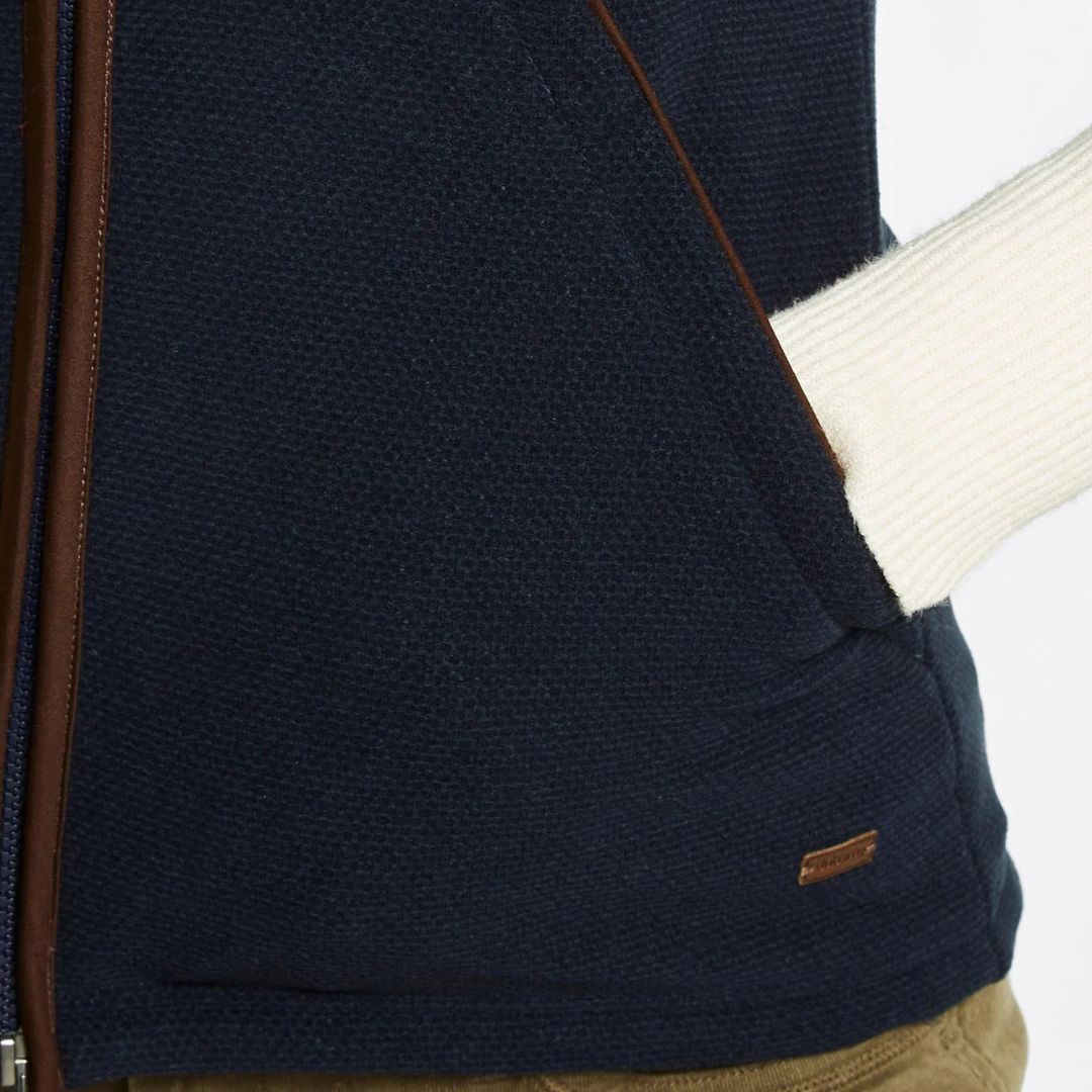 Navy blue textured sweater with a brand logo on a white background