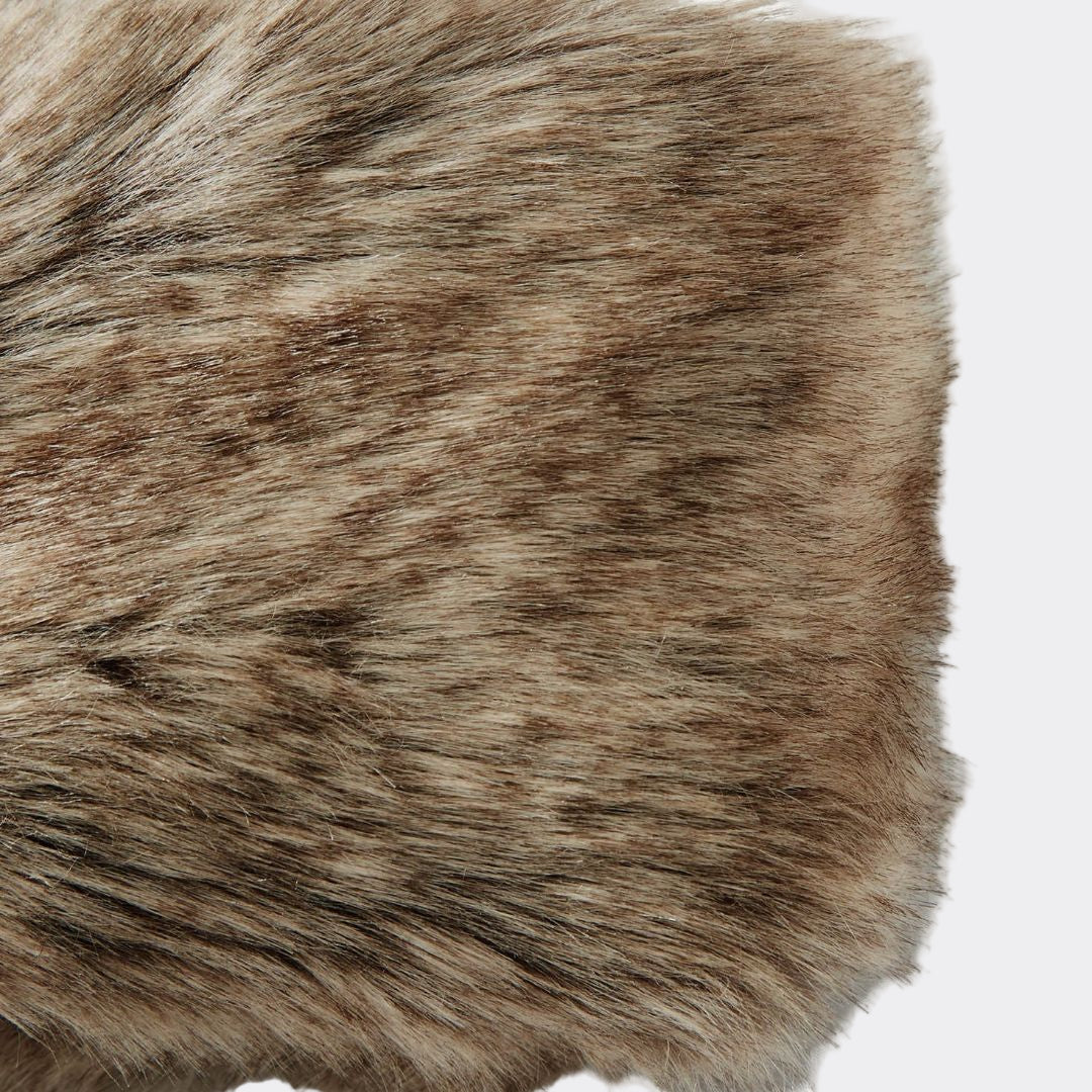 Close-up of brown fur texture on a white background