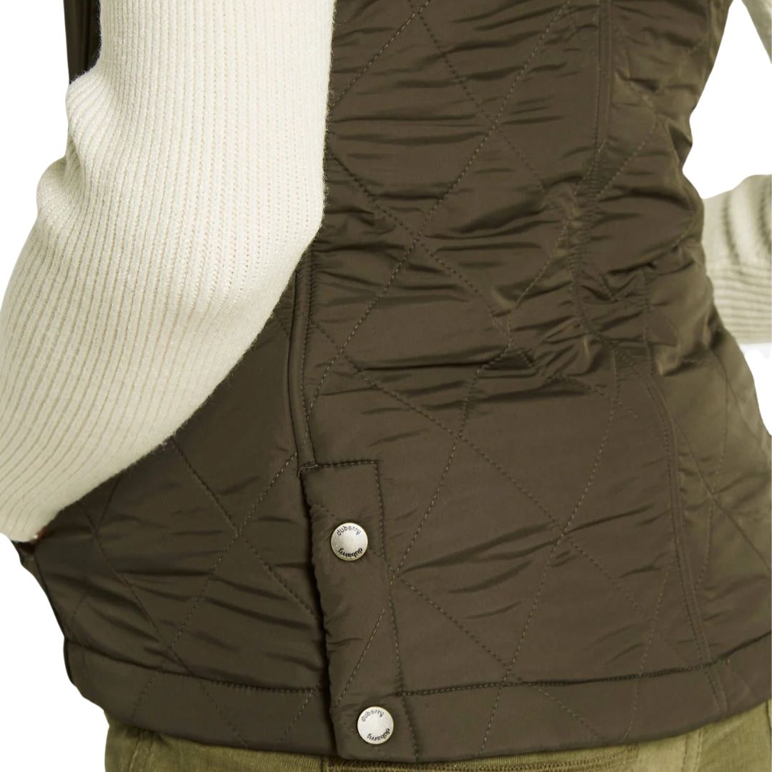 Close-up of a brown quilted vest with a button on a white background