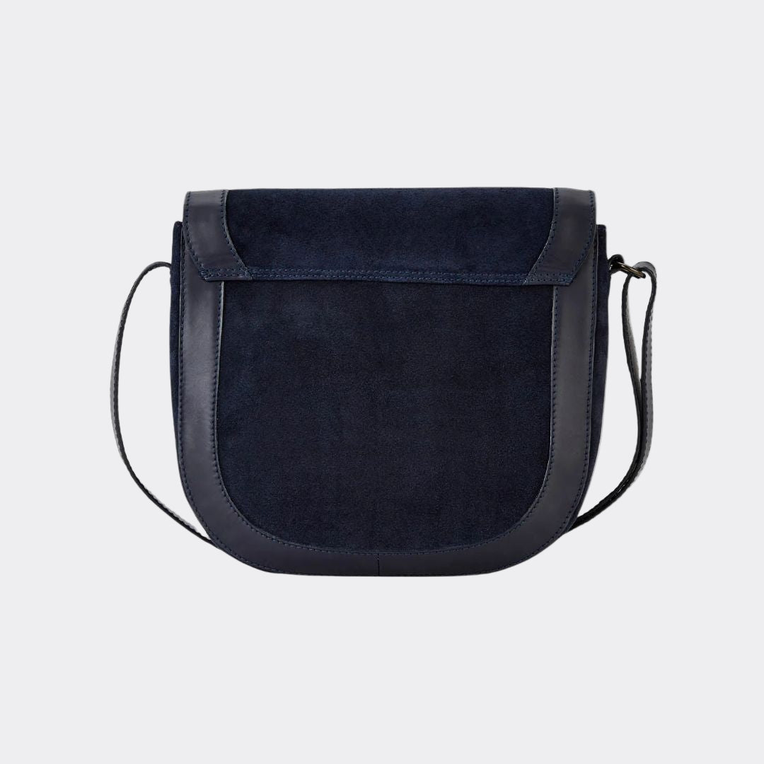 Black suede handbag with a strap on a white background