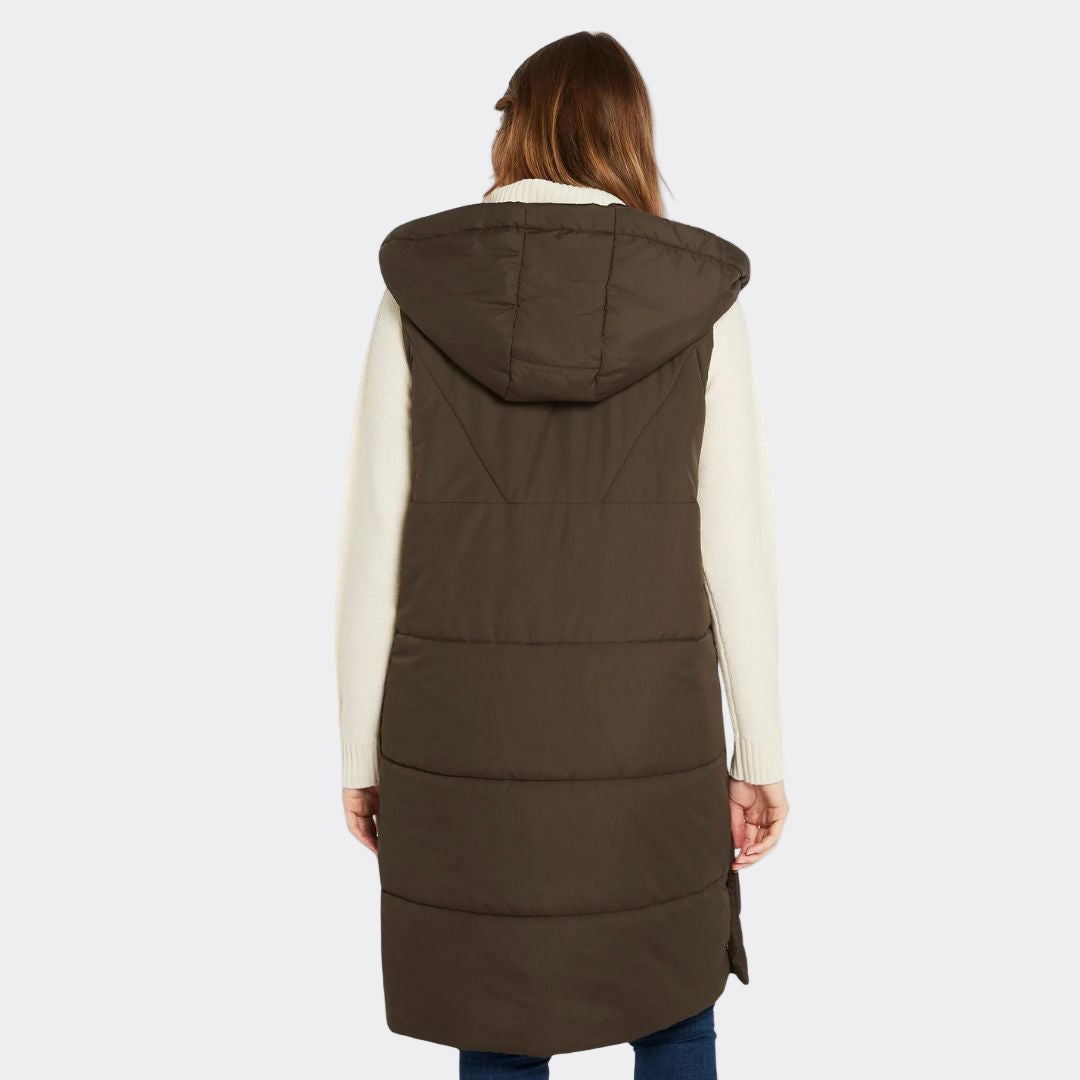 Brown puffer vest worn by a person on a white background