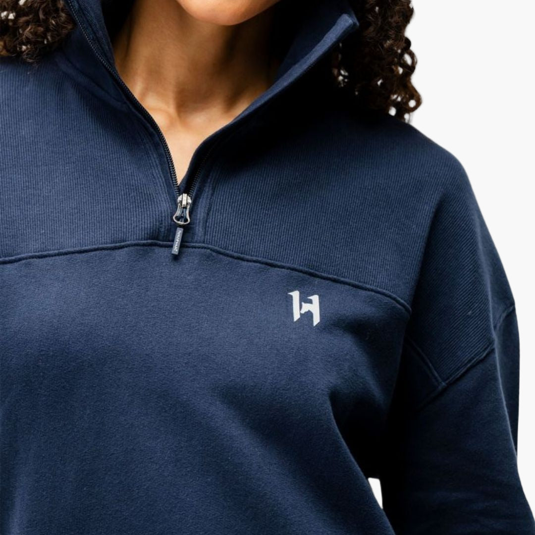 Navy blue pullover with a logo on a white background
