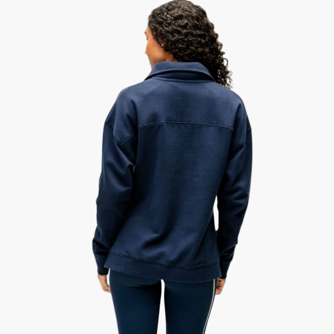 Person wearing a navy blue jacket on a white background