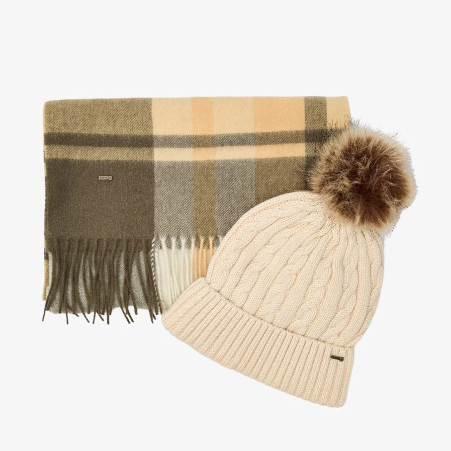 Beige knit hat with pom-pom and plaid scarf on a white background