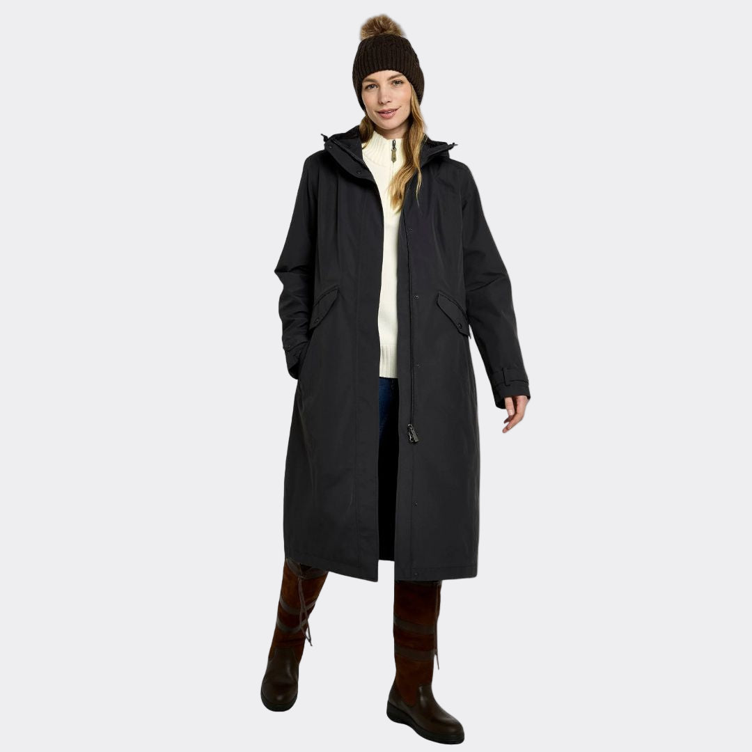 Person wearing a long black coat on a white background
