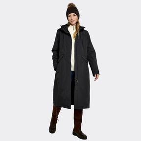 Person wearing a long black coat on a white background