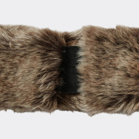 Close-up of a fur headband with a black elastic band on a white background