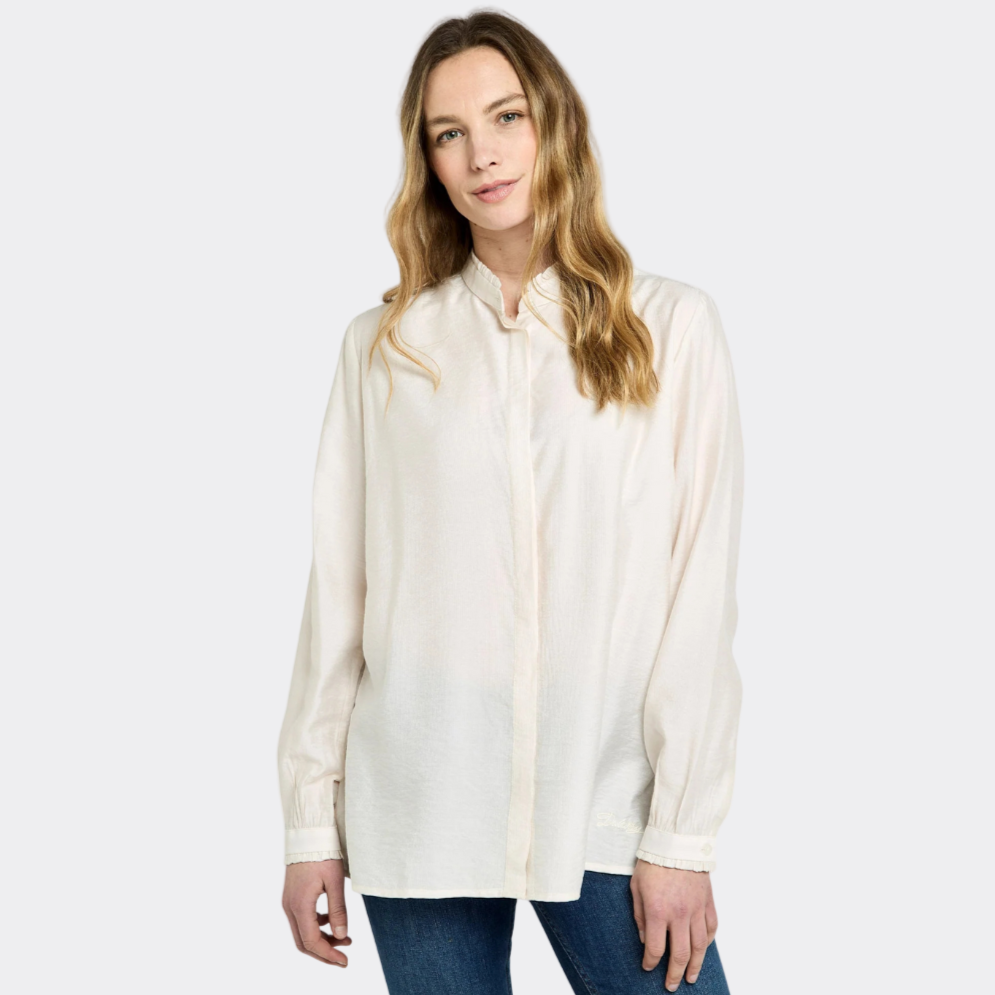 Woman wearing a white blouse and blue jeans on a white background
