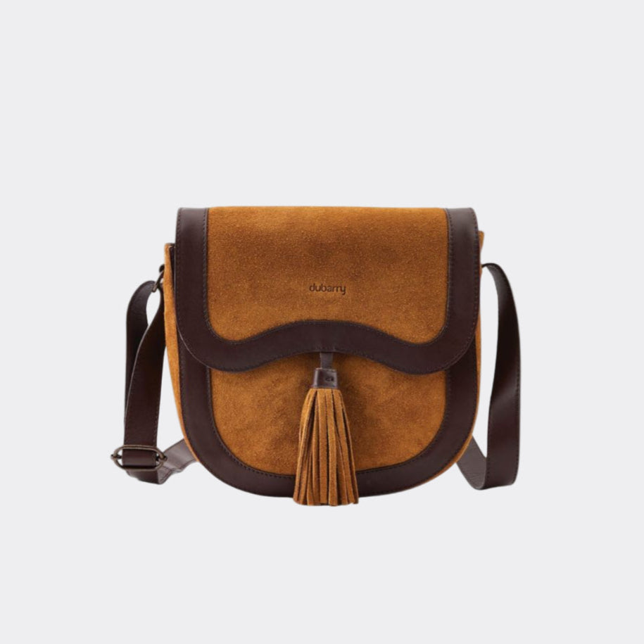 Brown leather crossbody bag with tassel on a white background