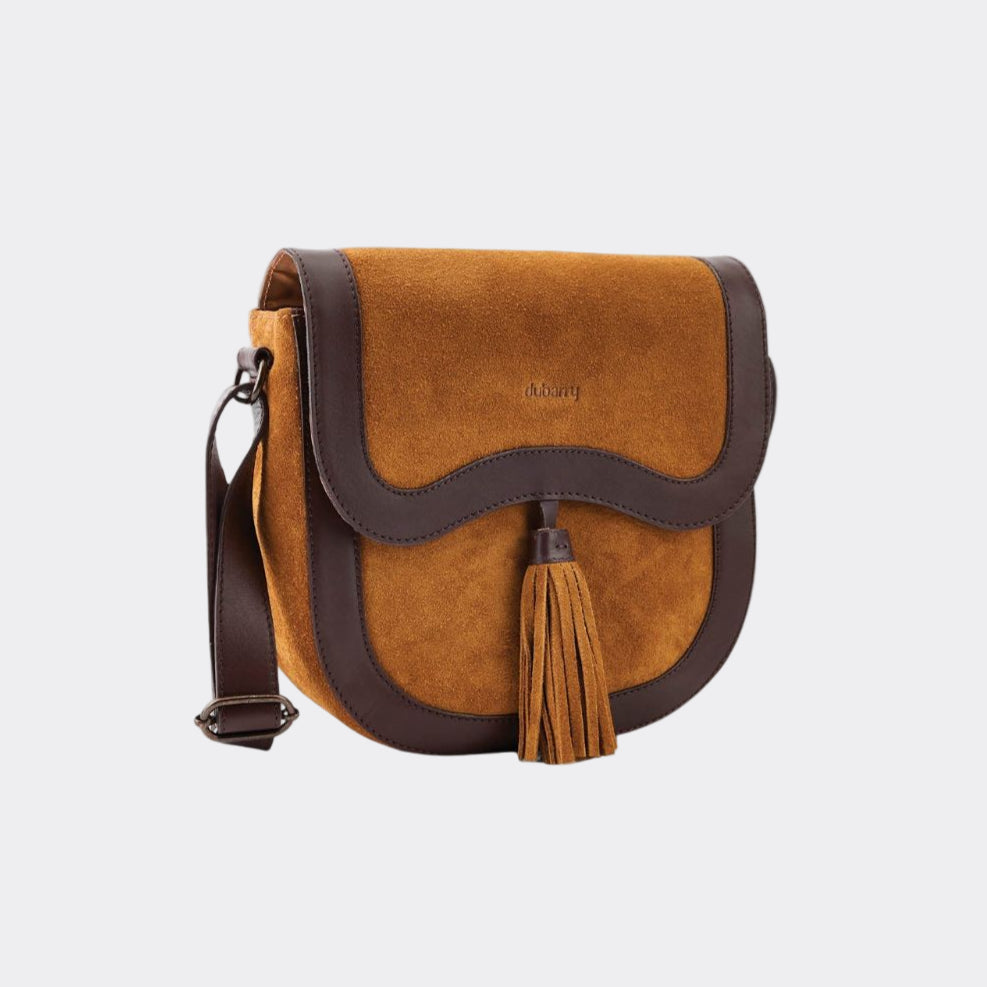Brown suede handbag with a tassel on a white background