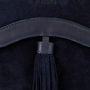 Navy blue leather belt with tassel on a dark background
