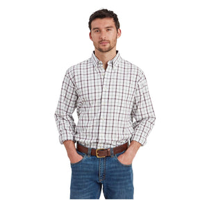 Man wearing a plaid shirt and jeans on a white background